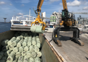 Illustration of RDF bales being loaded into a ship for export